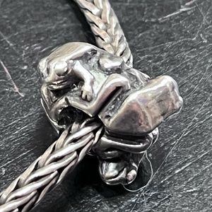 Trollbeads.  Four frogs big